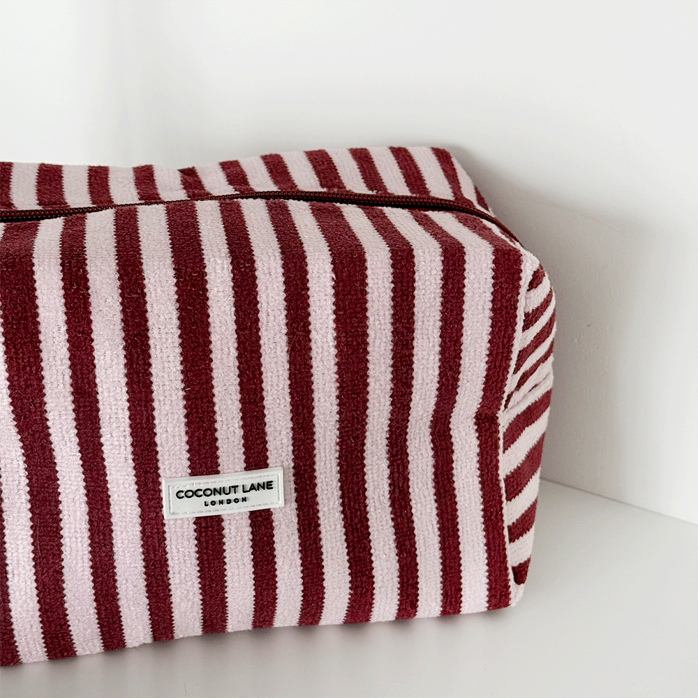 Burgundy and light pink striped Makeup Bag, silver zip and Coconut Lane logo badge.