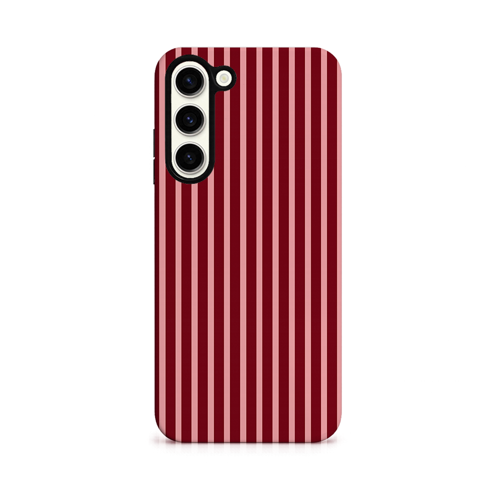 A smartphone with a red and white vertical striped case is shown from the back, displaying three rear camera lenses on the upper left side.