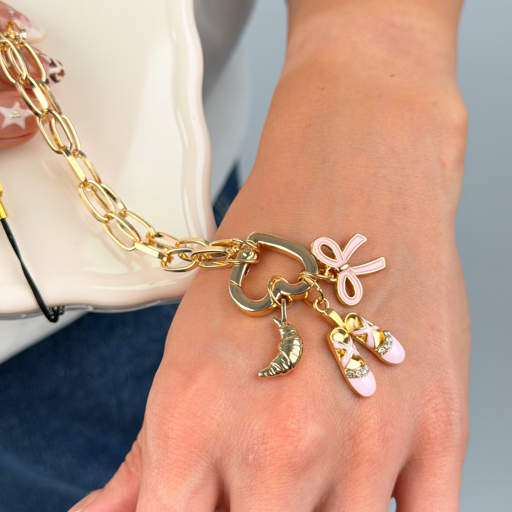 Close up of charms on the Paperclip Heart Ring Phone Strap