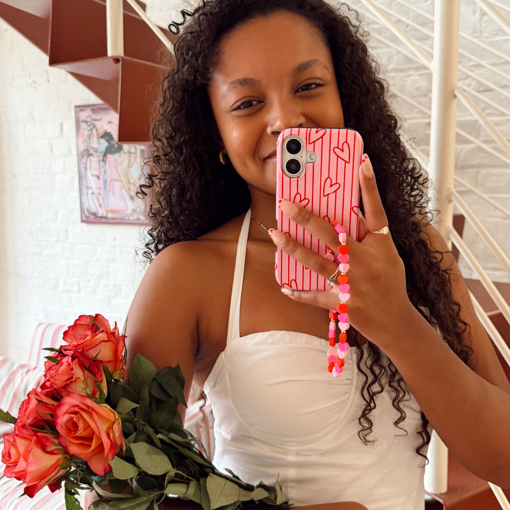 Girl with hearts phone strap