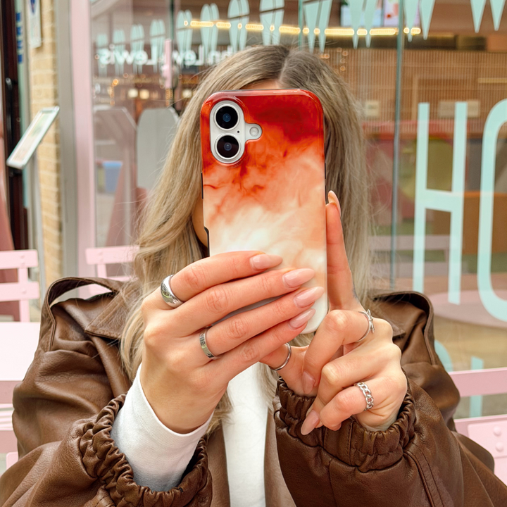 Girl in a brown jacket at a cafe taking a selfie with Iced Latte Tough Phone Case