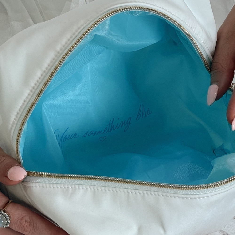 Blue interior and 'Your something blue' text written inside make up bag