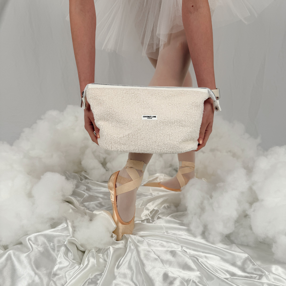 Girl in a dreamy cloud setting wearing ballet shoes 