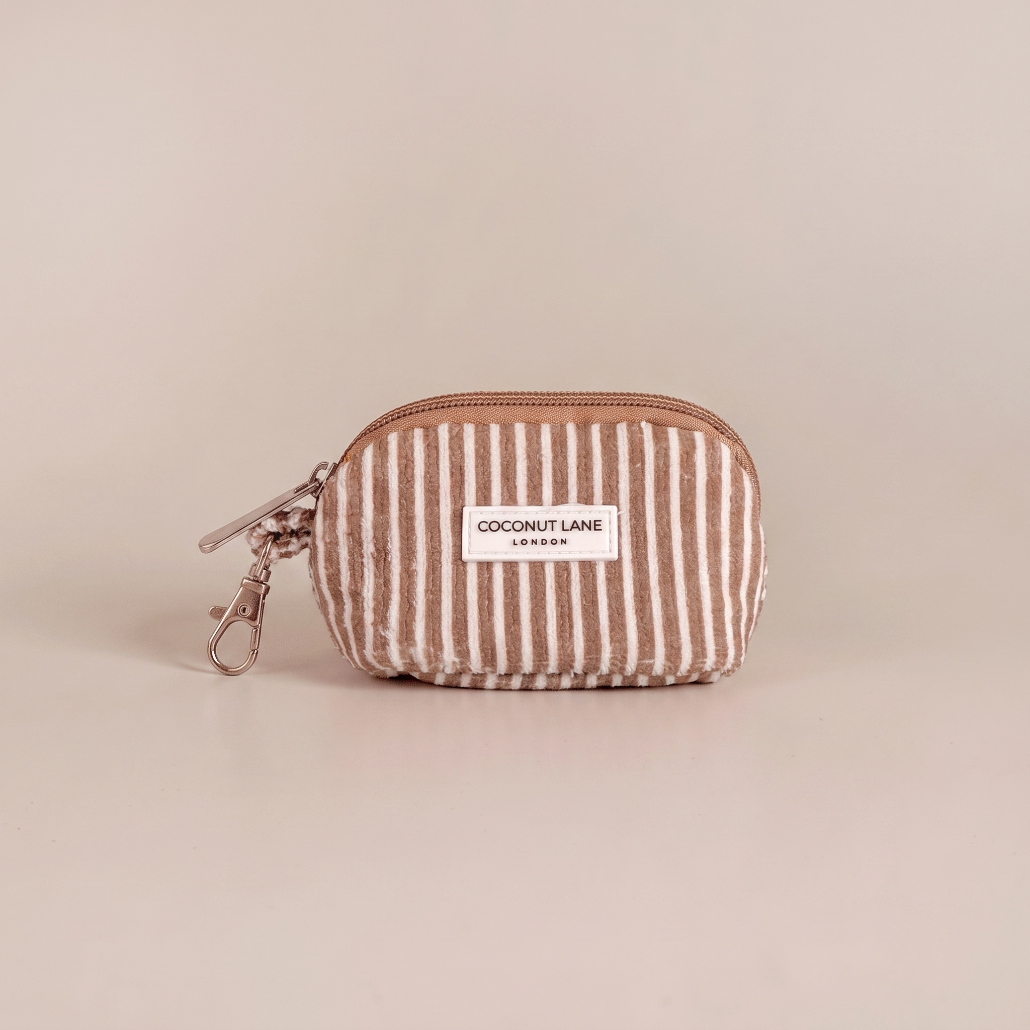 Brown and white stripe small keyring bag with zip closure and keychain attachment.