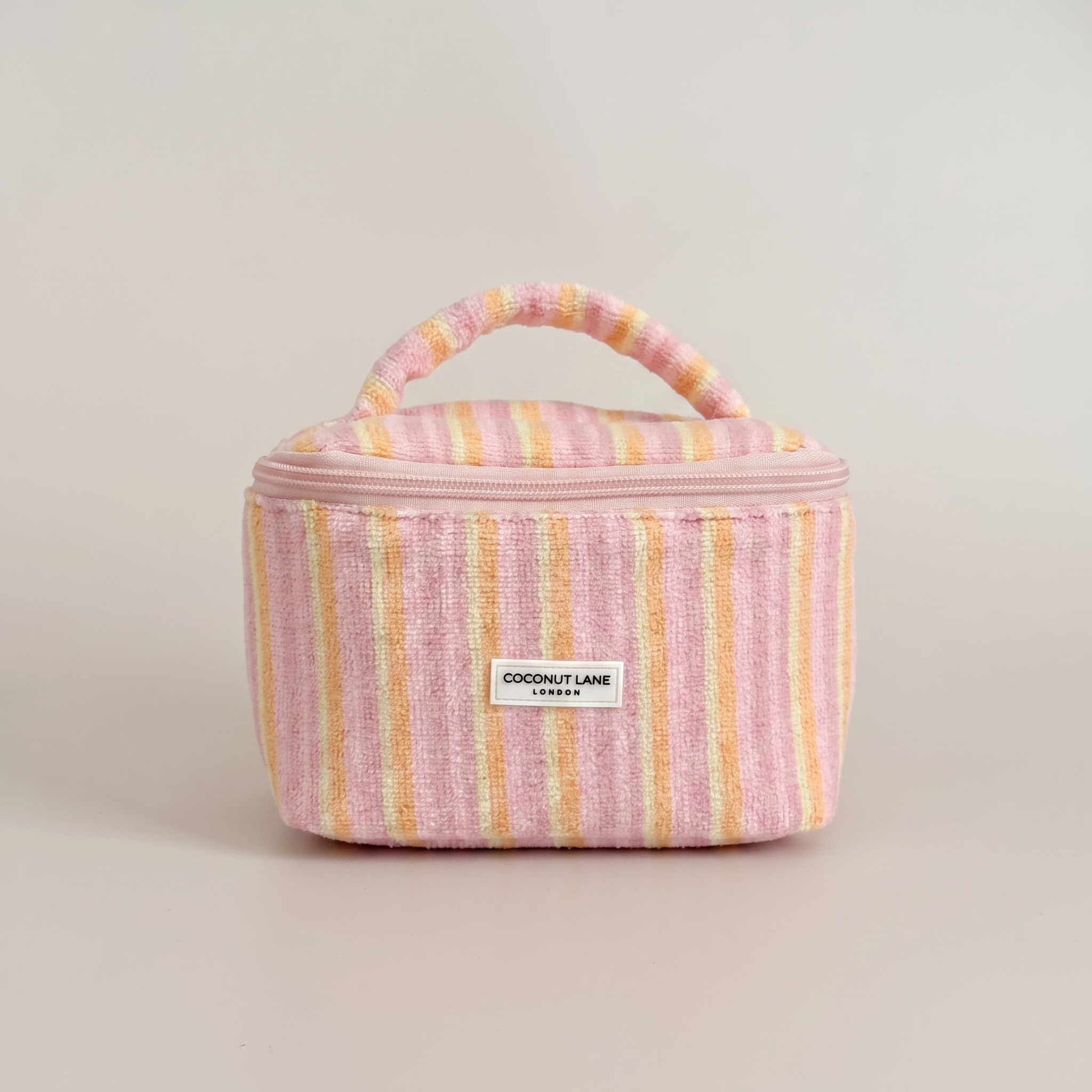 Pink,orange and yellow stripe small Vanity Bag with zip closure and padded handle.
