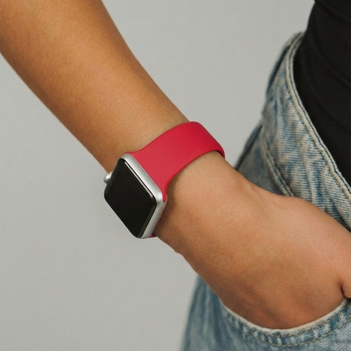 Girls hand in pocket of jeans showing off the NAKD Cherry Apple Watch Strap