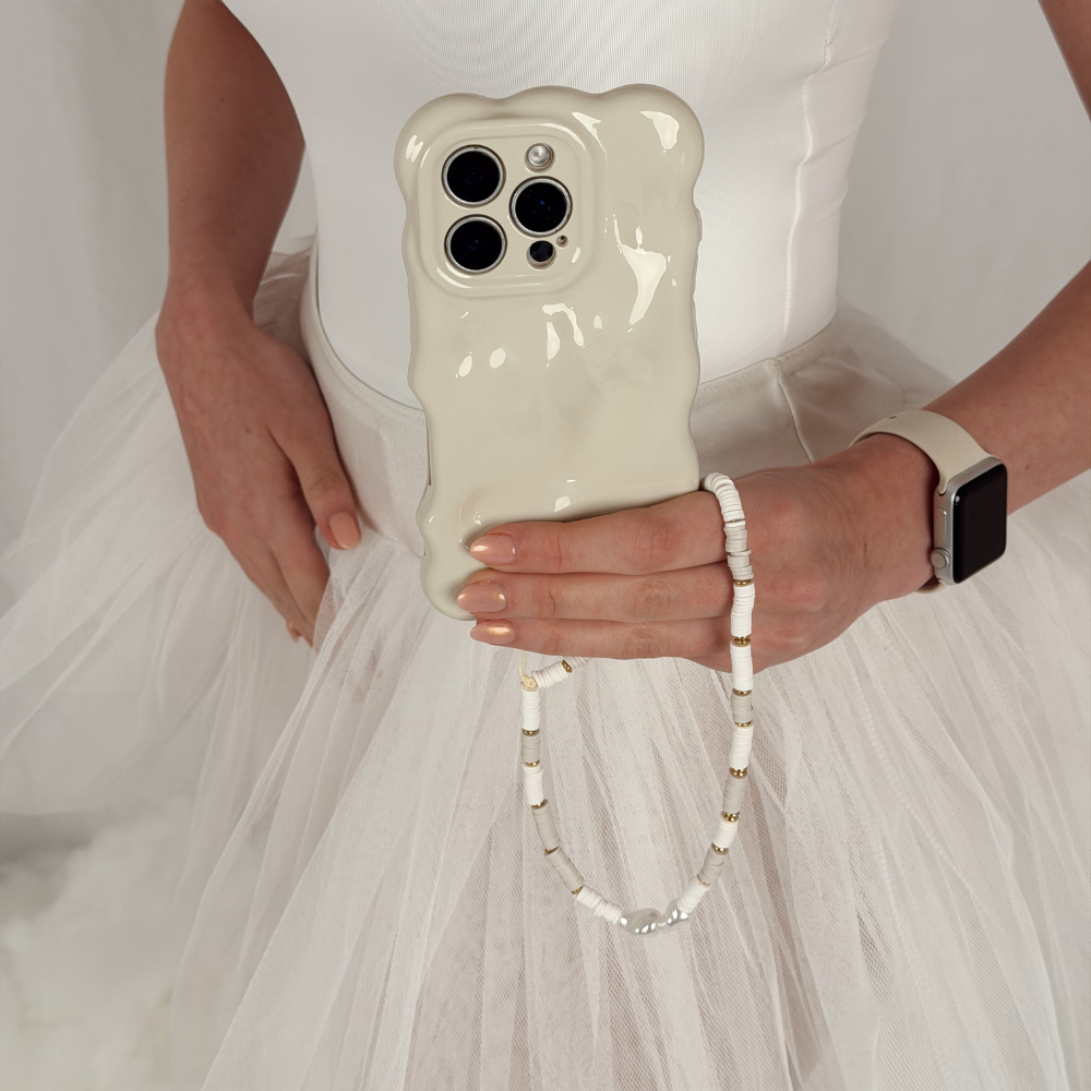 Nude & Pearl Phone Strap attached to phone case