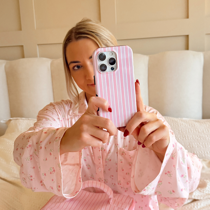 Girl in bed taking selfie with Powder Stripes Phone Case