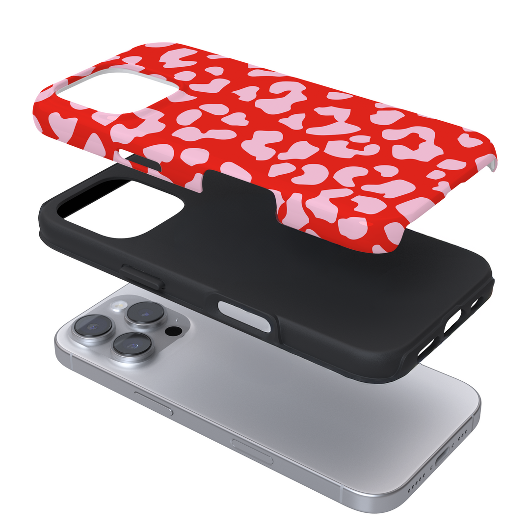 Expanded view of a phone case with a red and pink leopard print on a white background