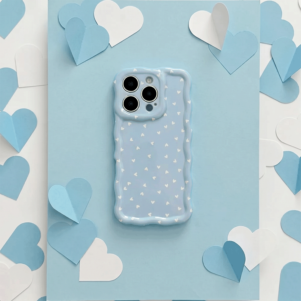 Wavy Phone Case with blue background and white hearts design. 