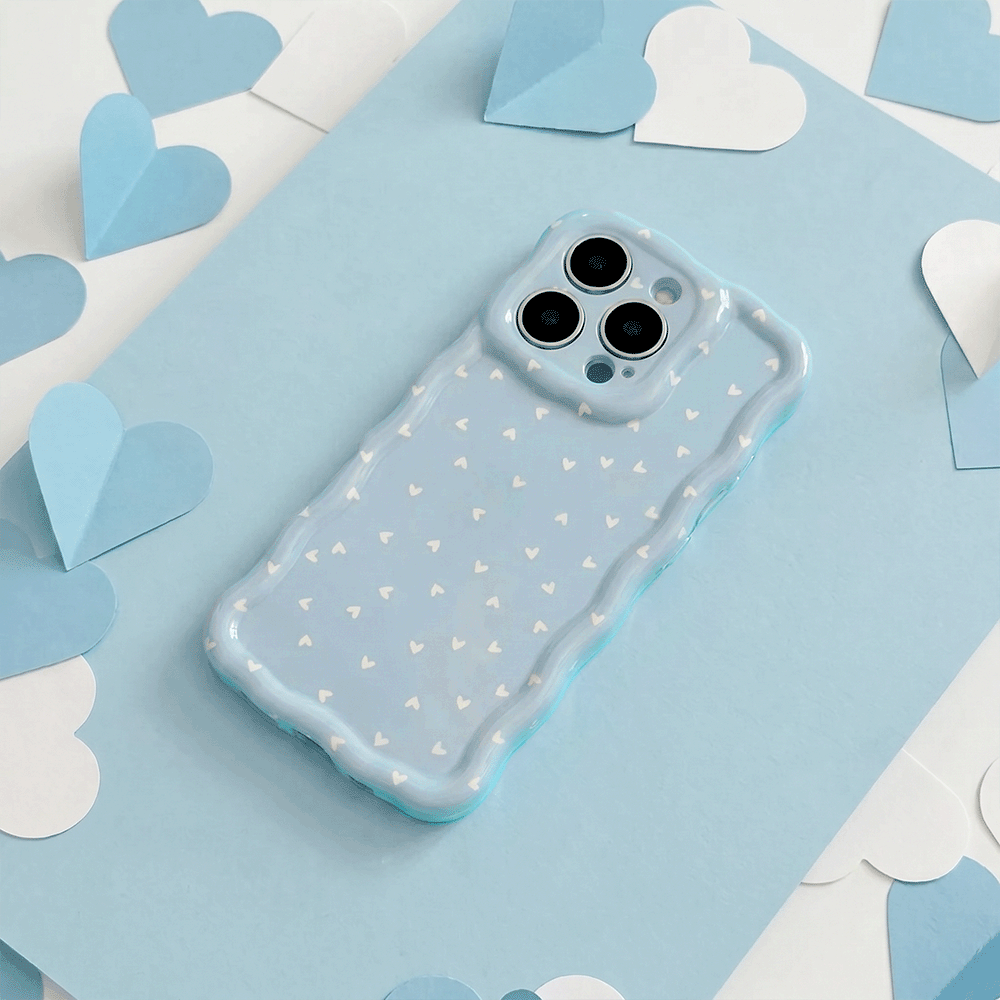 Wavy Phone Case with blue background and white hearts design. 
