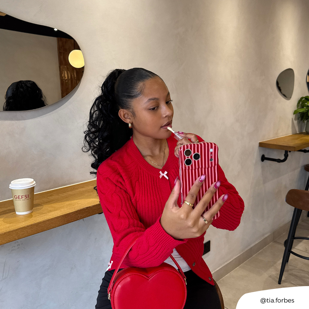 Girl applying lip gloss holding Wavy Phone Case Mulberry Stripes