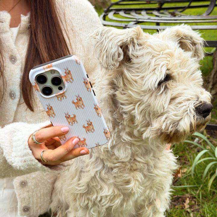 Girl holding hoppy pup magsafe phone case next to white dog